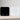 Acaia Pearl Coffee Scale in black and white with bright digital display on a wooden counter