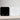 Acaia Pearl Coffee Scale in black and white with bright digital display on a wooden counter