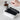 White Acaia Pearl Coffee Scale weighing a portafilter during espresso preparation