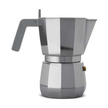 Grey Alessi Moka 6-cup espresso maker side view on a white background, showing the grey handle, polished faceted body and gold safety valve.