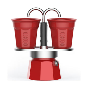 Bialetti Red Mini Express 2 Cup stovetop coffee maker with two red Bicchierini cups for direct-to-cup brewing.