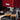Close-up of red Gaggia Classic espresso machine brewing espresso into two glass cups