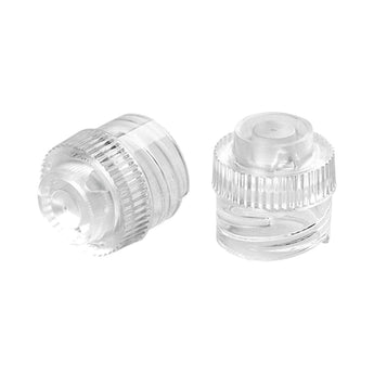 Two clear Jura interchangeable milk spouts, one upright and one on its side, on white