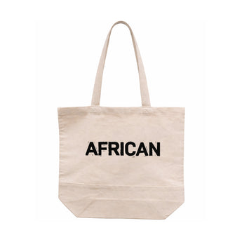 Bean There African tote bag in natural canvas with bold “AFRICAN” text print and long shoulder straps