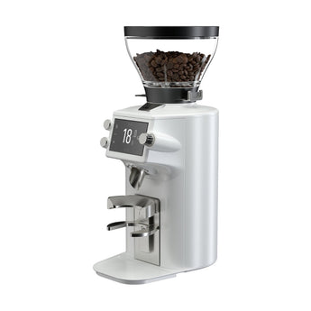 White Mahlkönig E64WS Grind-By-Sync grinder with clear bean hopper, 18 g display and portafilter holder on a white background