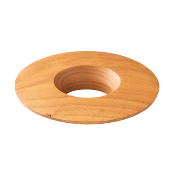 Origami Wooden Coffee Dripper Holder in warm natural wood, shown from a low side angle with a central opening