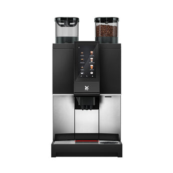 WMF 1300S coffee machine front view with illuminated touchscreen and dual grinders