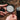 AeroPress Reusable Metal Filter fitted inside an AeroPress filter cap during outdoor brewing