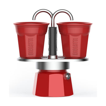Bialetti Red Mini Express 2 Cup stovetop coffee maker with two red Bicchierini cups for direct-to-cup brewing.