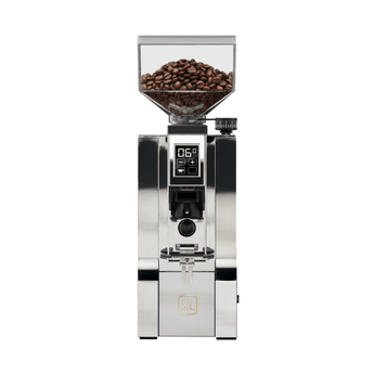 Front view of the Eureka Mignon XL Chrome grinder with a full hopper of coffee beans, digital display, and portafilter fork.