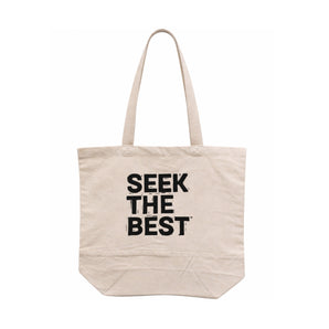 Bean There tote bag in natural canvas with bold “SEEK THE BEST” text print and long shoulder straps
