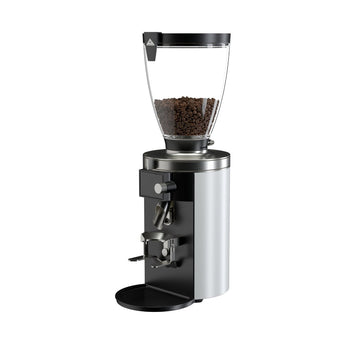 Angled view of the white Mahlkönig E65S grinder with a clear bean hopper, grind adjustment dial, and portafilter holder.