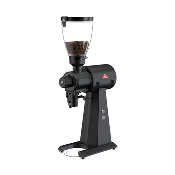 Angled front-side view of the black Mahlkönig EK43 grinder with a clear hopper filled with coffee beans and a large external grind adjustment dial.