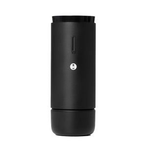 Front view of the black Whirly portable electric coffee grinder with power button and logo detail